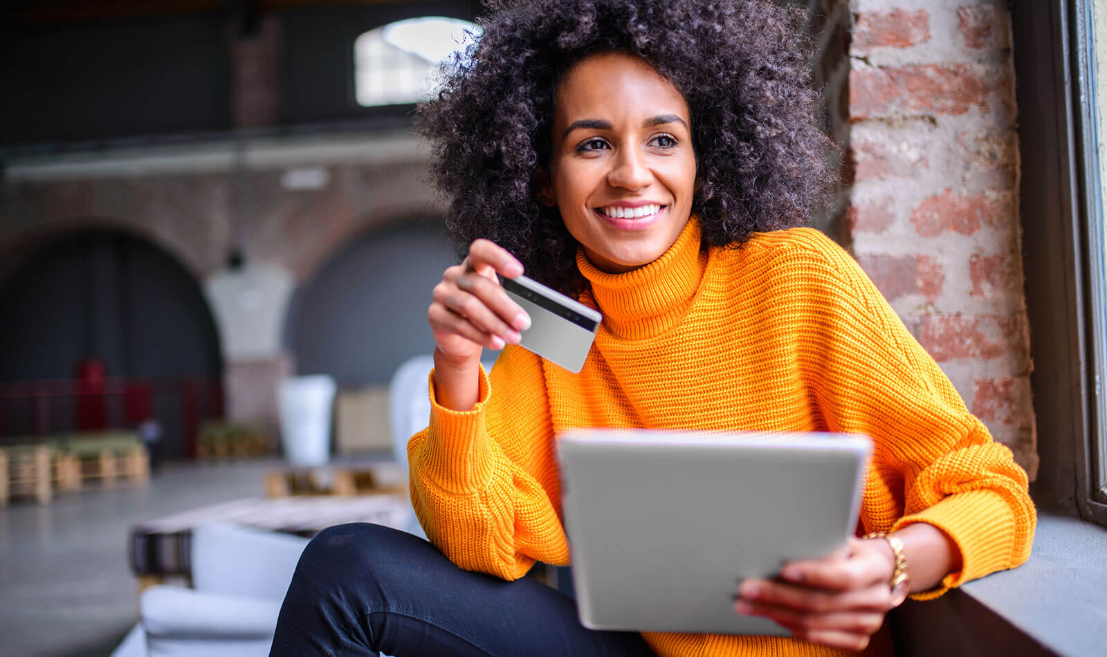 Image of woman using debit card